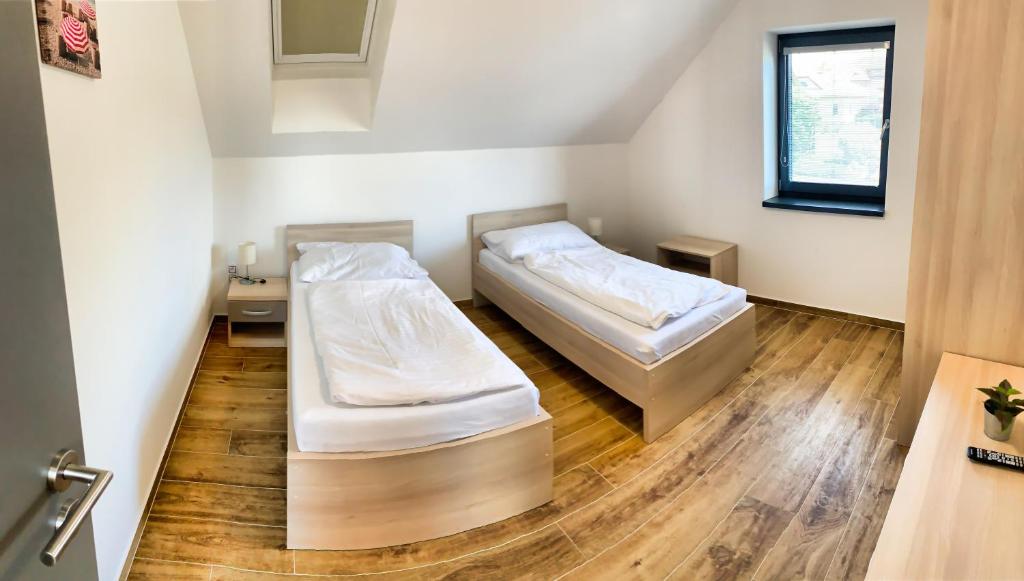 Postel nebo postele na pokoji v ubytování Apartmánové domy Lipno 1