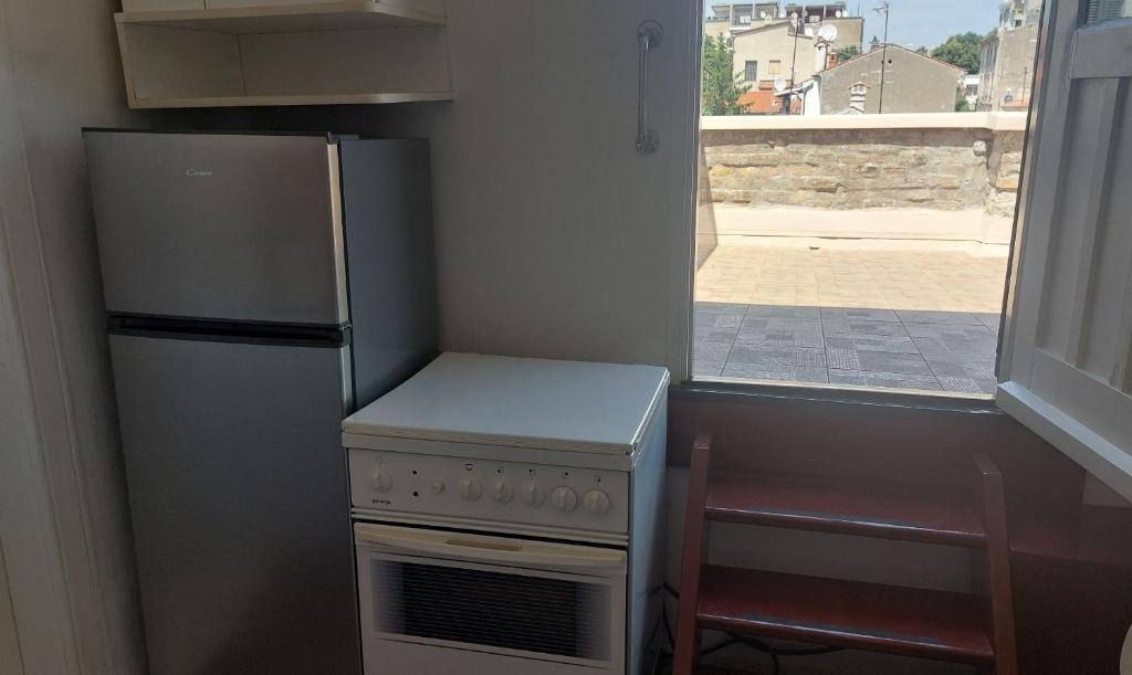 A cozinha ou kitchenette de Apartment in centre with huge terace