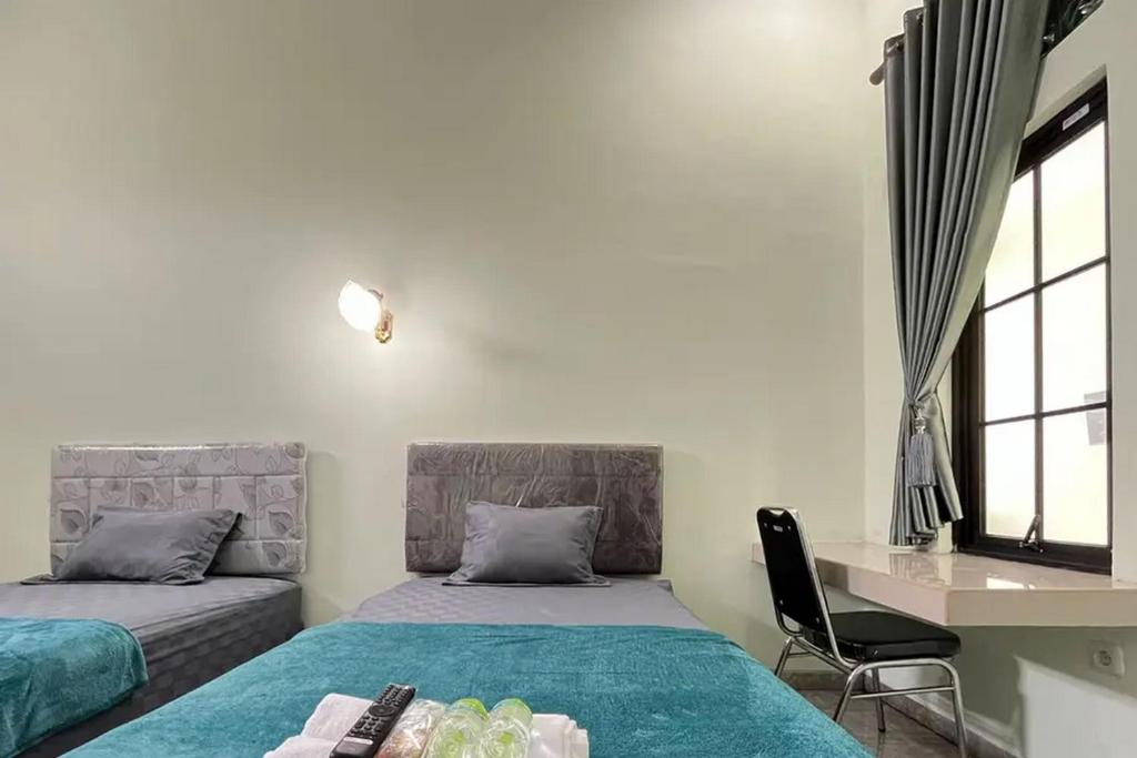 Trubus Guesthouse Syariah Magelang mitra RedDoorz - Chambre Lits Jumeaux Standard