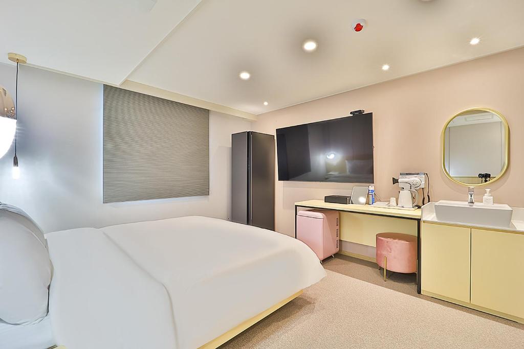 Postel nebo postele na pokoji v ubytování Rubato Hotel Ulsan Junggu