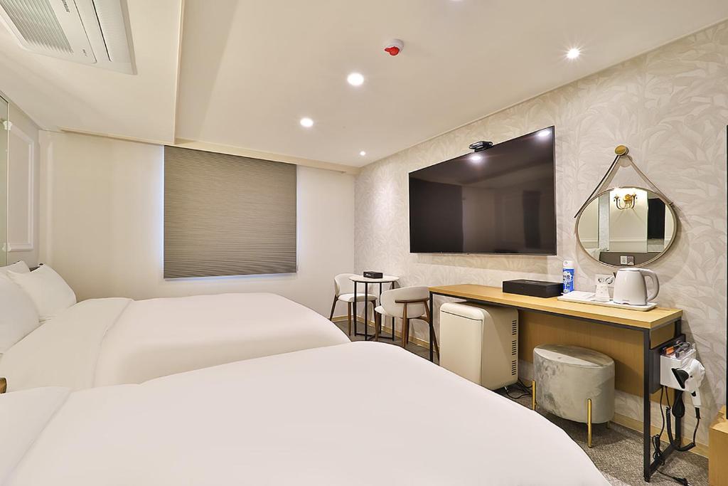 Postel nebo postele na pokoji v ubytování Rubato Hotel Ulsan Junggu