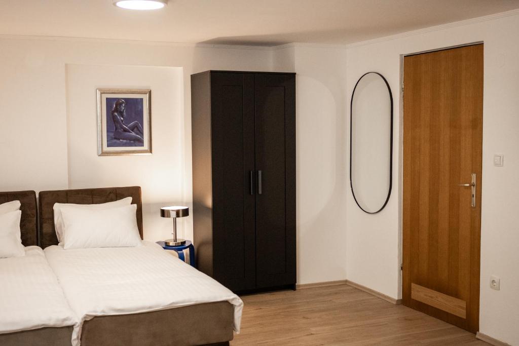 Postel nebo postele na pokoji v ubytování Brodnik Apartment