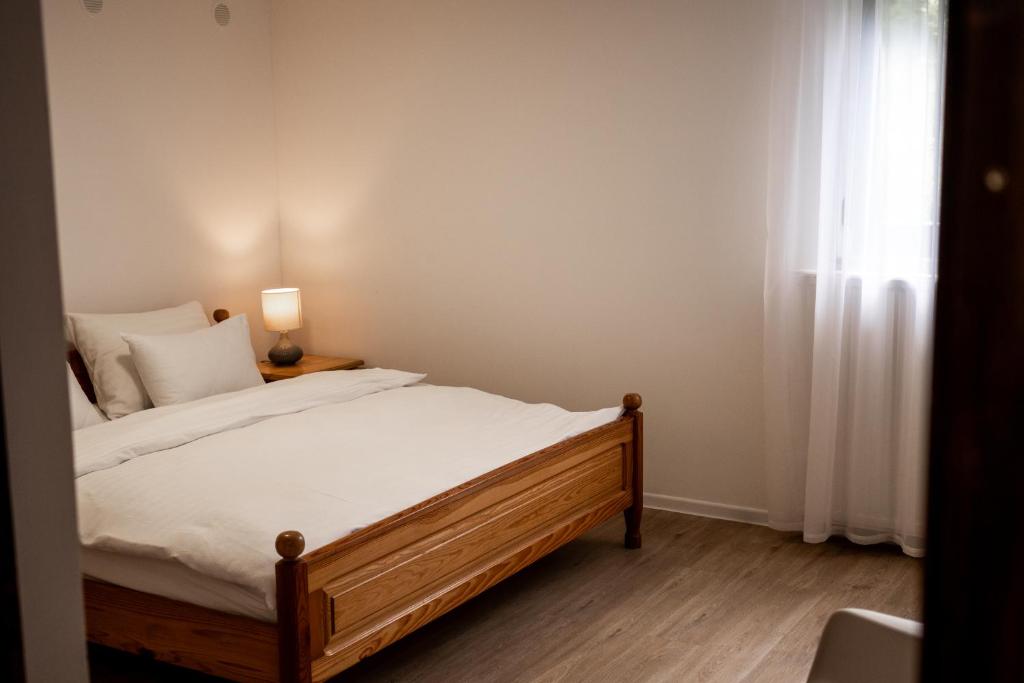 Postel nebo postele na pokoji v ubytování Brodnik Apartment