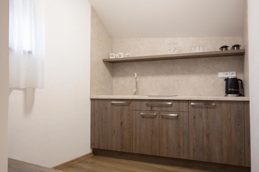 Kuchyň nebo kuchyňský kout v ubytování Apartmán nad sklepem