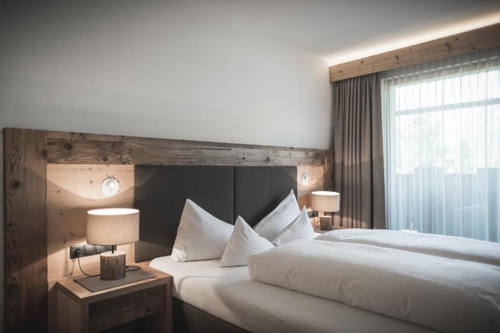 Postel nebo postele na pokoji v ubytování Hotel Alpenblick