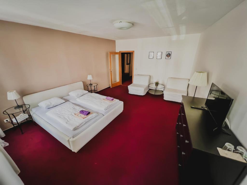 Postel nebo postele na pokoji v ubytování hotel Florian Sedlčany