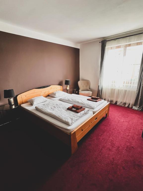 Postel nebo postele na pokoji v ubytování hotel Florian Sedlčany