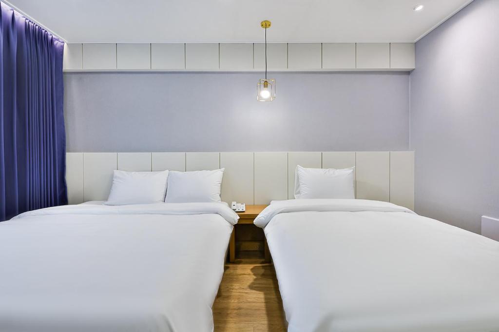 Postel nebo postele na pokoji v ubytování Hotel Langsam