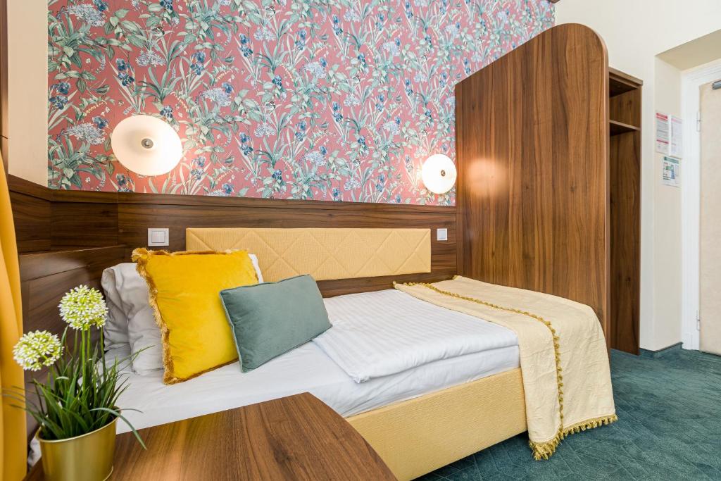 Postel nebo postele na pokoji v ubytování Hotel Arcus Garden