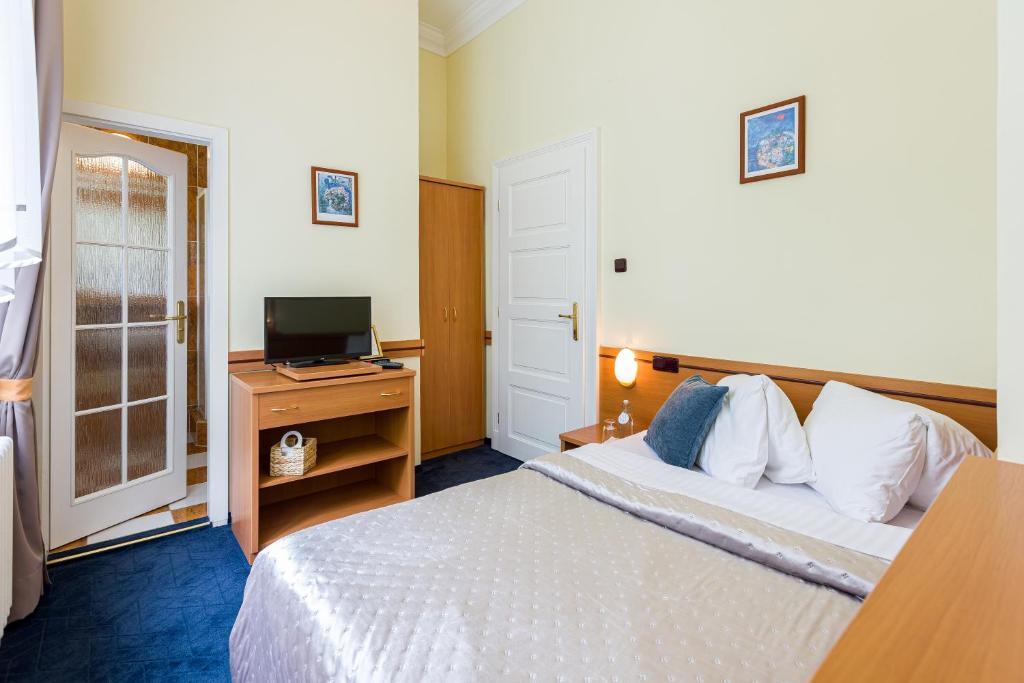 Postel nebo postele na pokoji v ubytování Hotel Arcus Garden