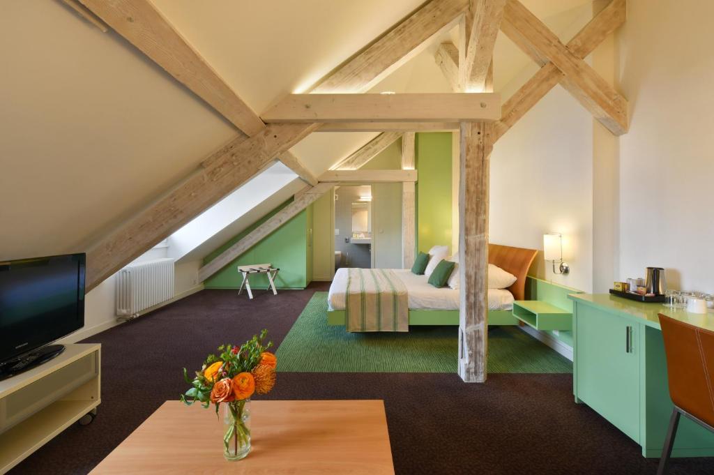 Postel nebo postele na pokoji v ubytování Hotel International & Terminus