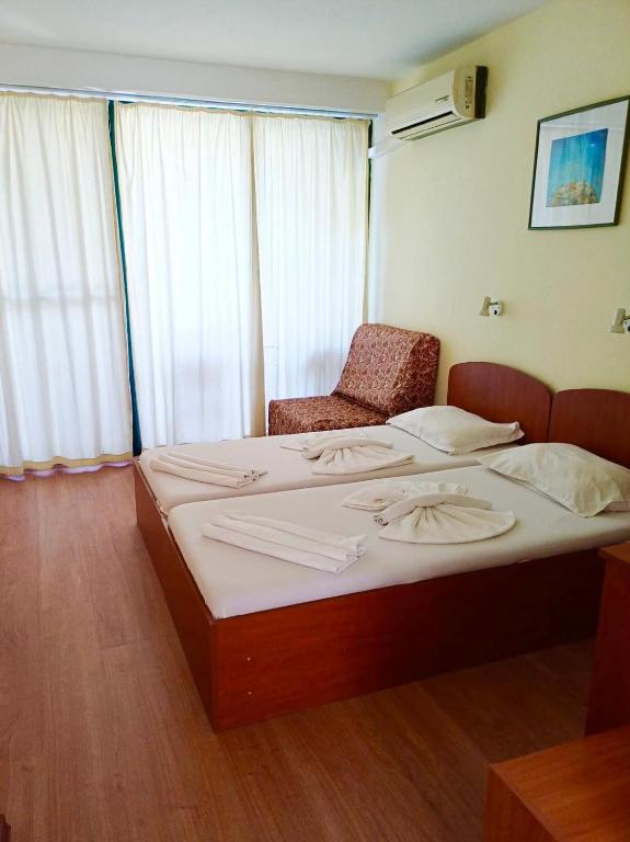 Postel nebo postele na pokoji v ubytování Hotel Nimfa-Rusalka