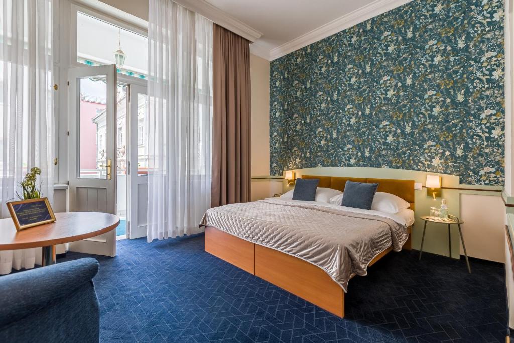 Postel nebo postele na pokoji v ubytování Hotel Arcus Garden