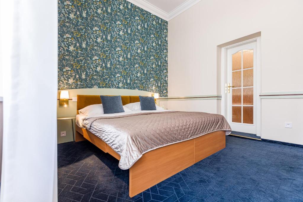 Postel nebo postele na pokoji v ubytování Hotel Arcus Garden