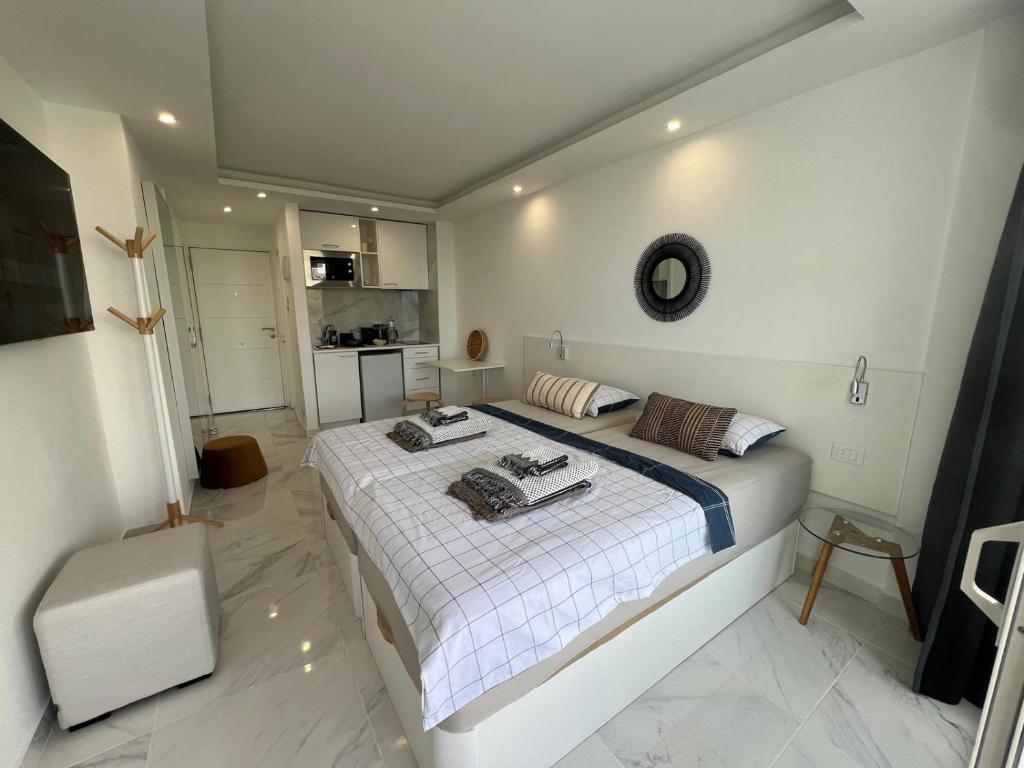 a bedroom with a bed with towels on it at Tenerife sea view 216 in Playa Fañabe