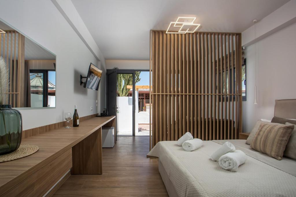 Postel nebo postele na pokoji v ubytování Cactus Suites