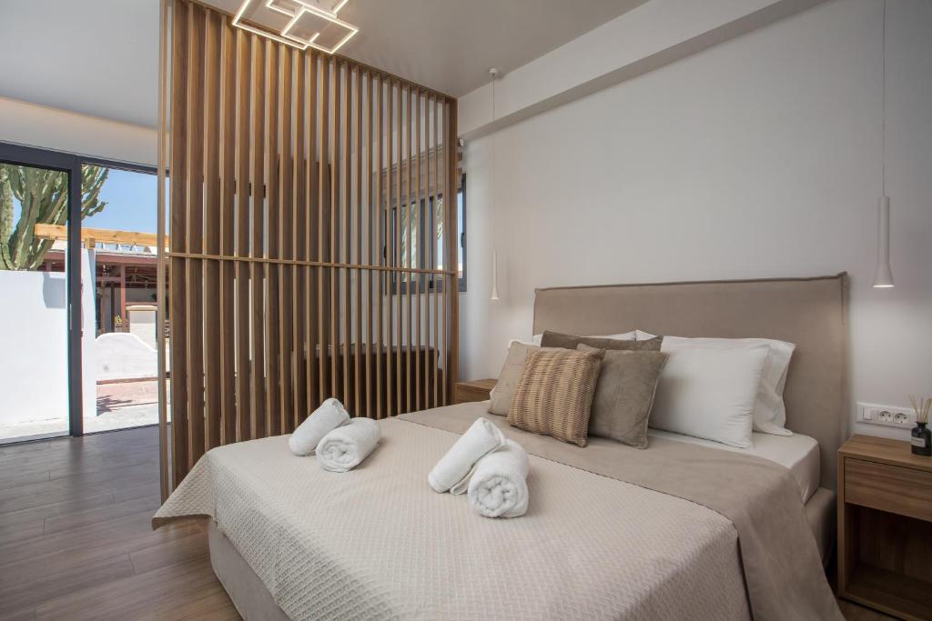 Postel nebo postele na pokoji v ubytování Cactus Suites