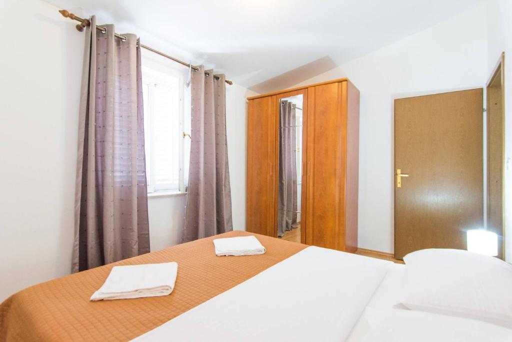 Łóżko lub łóżka w pokoju w obiekcie Apartment Rajna