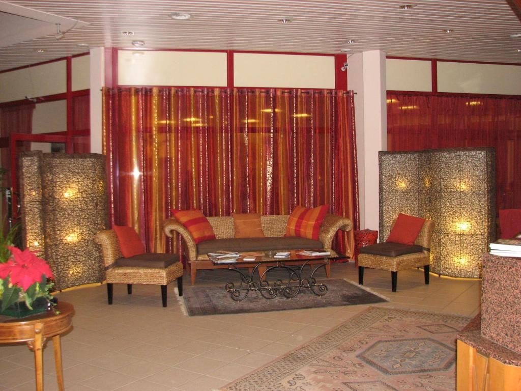 Posezení v ubytování Hotel Le Cedre