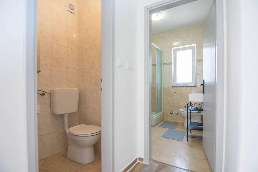 Kúpeľňa v ubytovaní Apartment Nia - dream vacation in Biograd
