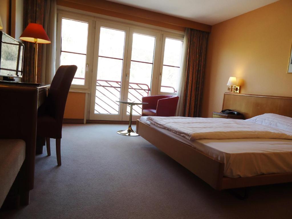 Postel nebo postele na pokoji v ubytování Hotel Le Cedre