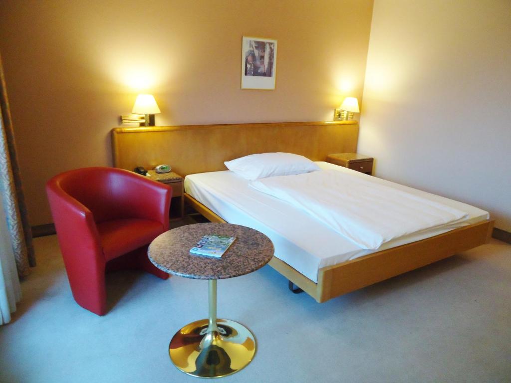 Postel nebo postele na pokoji v ubytování Hotel Le Cedre
