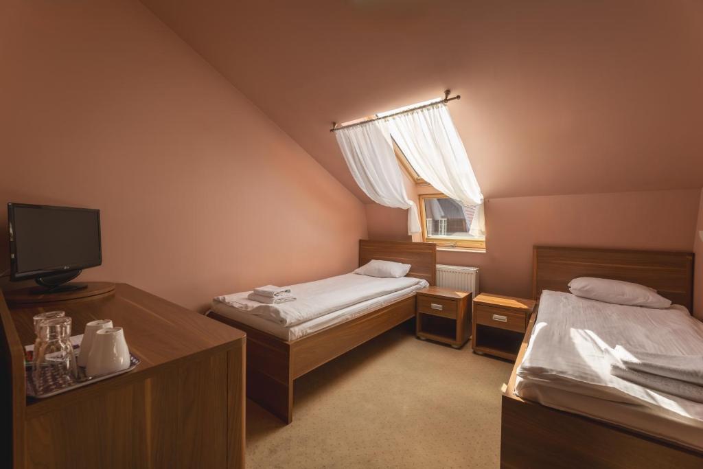 Posteľ alebo postele v izbe v ubytovaní Paria Hotel