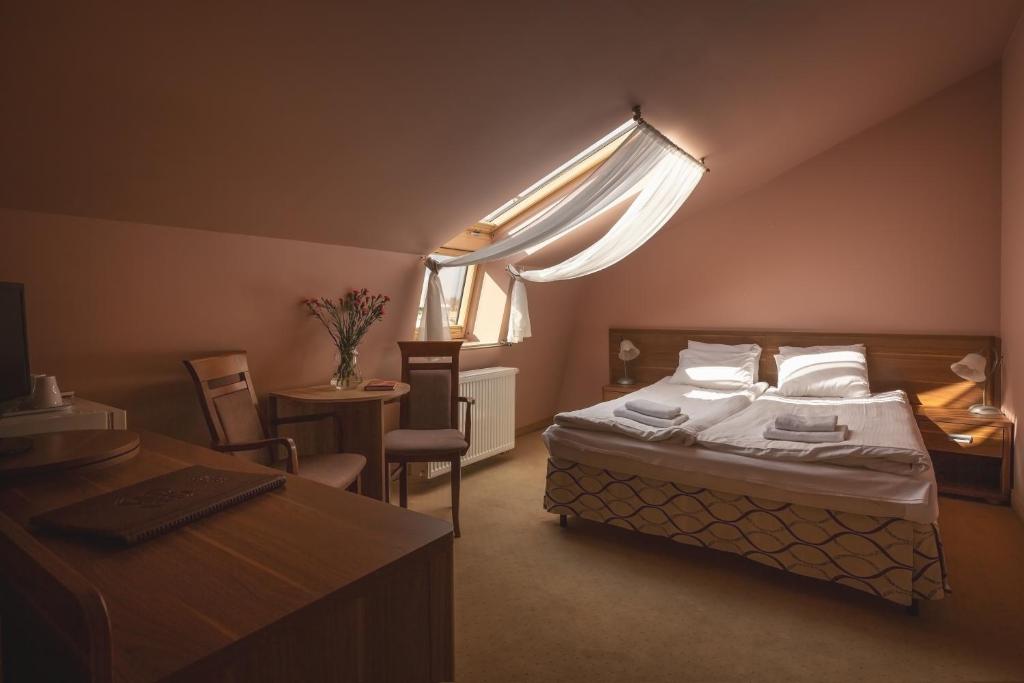 Posteľ alebo postele v izbe v ubytovaní Paria Hotel