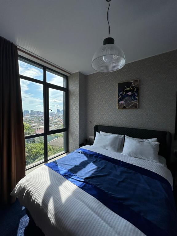 Postel nebo postele na pokoji v ubytování 10inn Boutique Hotel