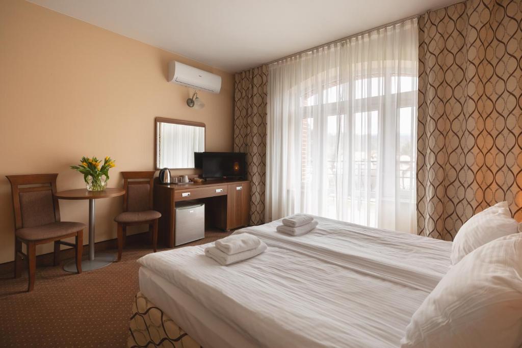Posteľ alebo postele v izbe v ubytovaní Paria Hotel