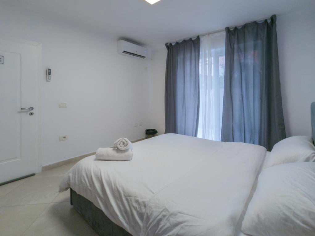 Postel nebo postele na pokoji v ubytování Center Luxury Rooms