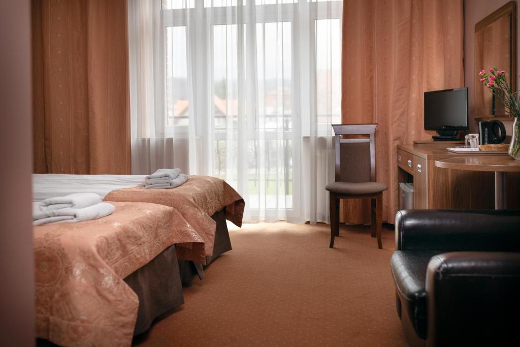 Posteľ alebo postele v izbe v ubytovaní Paria Hotel