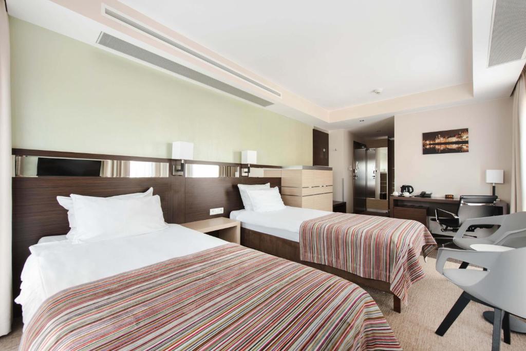 Postel nebo postele na pokoji v ubytování Hotel Arkon Park Gdańsk- Destigo Hotels