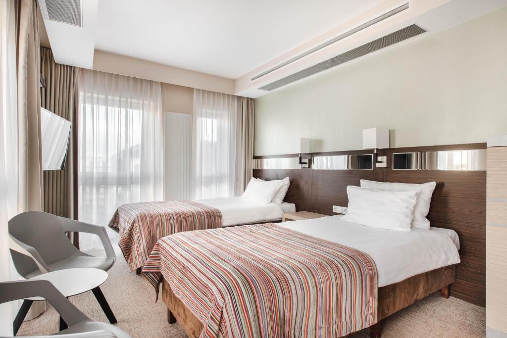 Postel nebo postele na pokoji v ubytování Hotel Arkon Park Gdańsk- Destigo Hotels