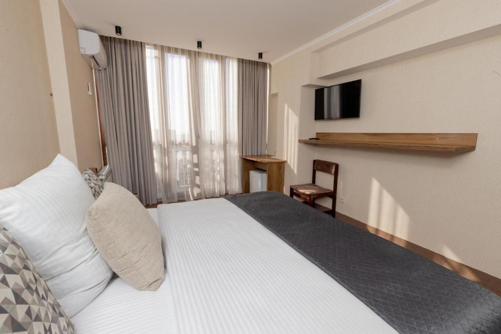 Postel nebo postele na pokoji v ubytování Shirak Hotel