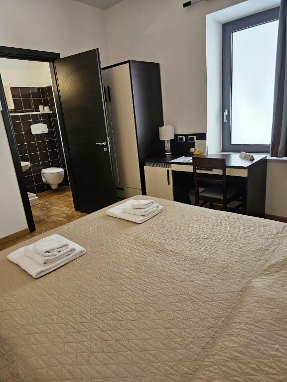 Postel nebo postele na pokoji v ubytování Baja delle Sirene