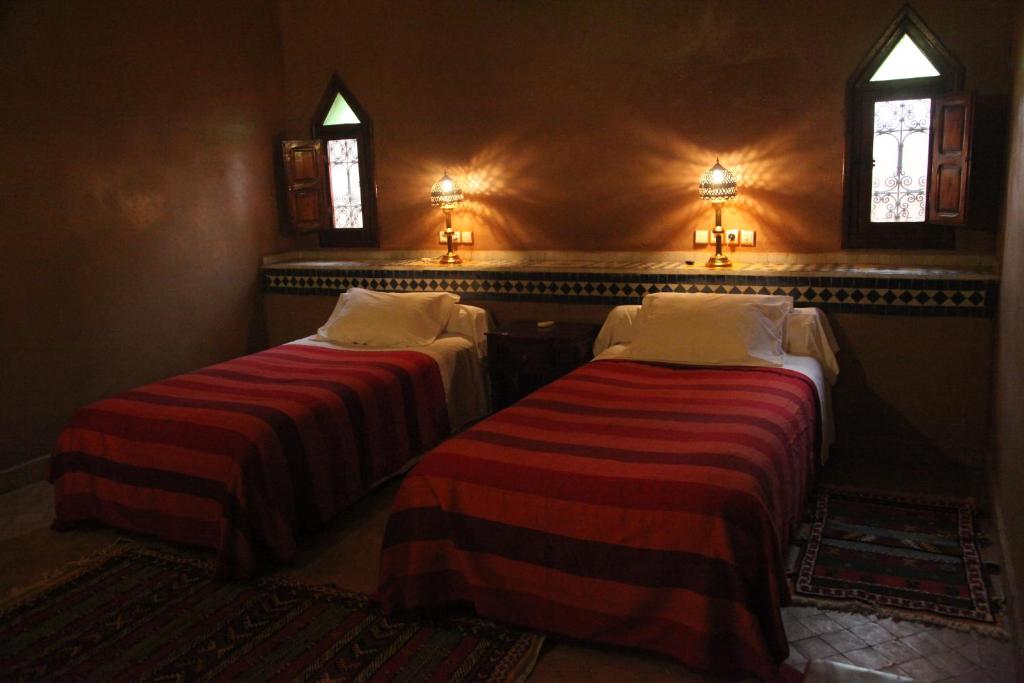 Letto o letti in una camera di Hotel Kasbah Azalay