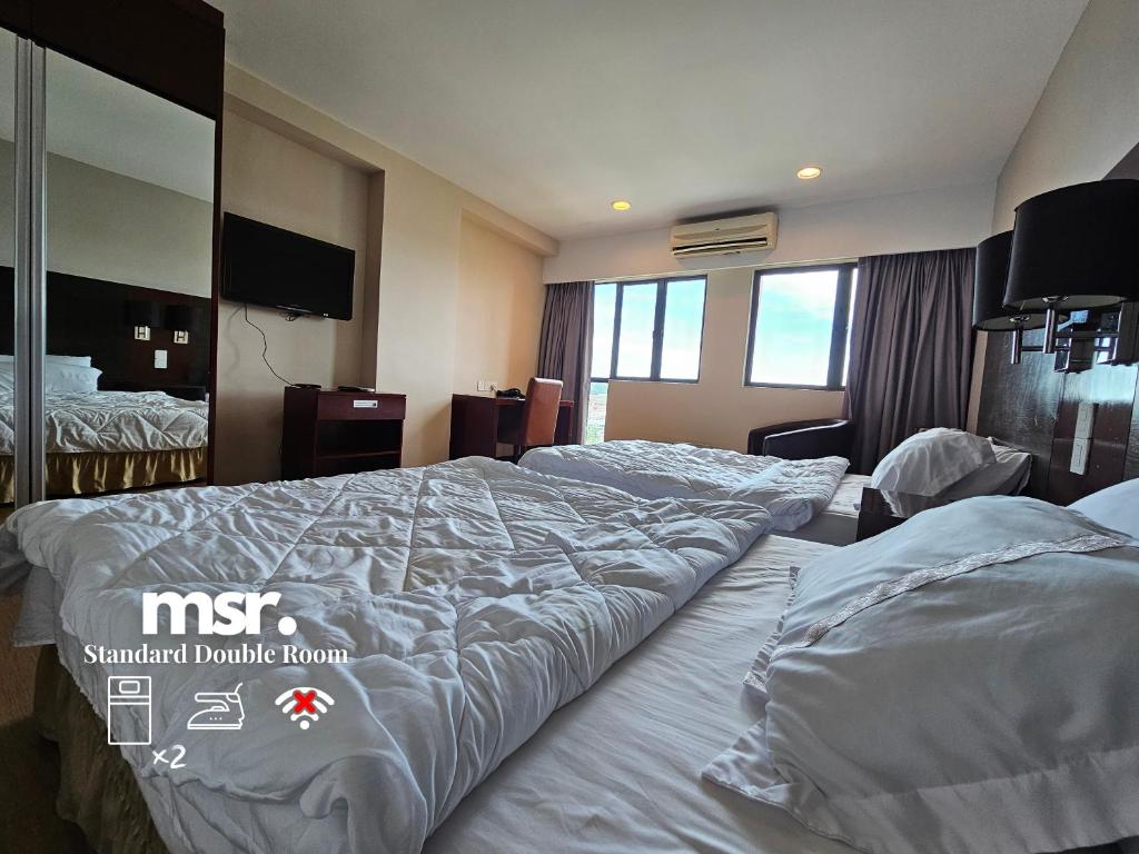 Postel nebo postele na pokoji v ubytování Kota Kinabalu City Ensuite at SCSP Ming Garden