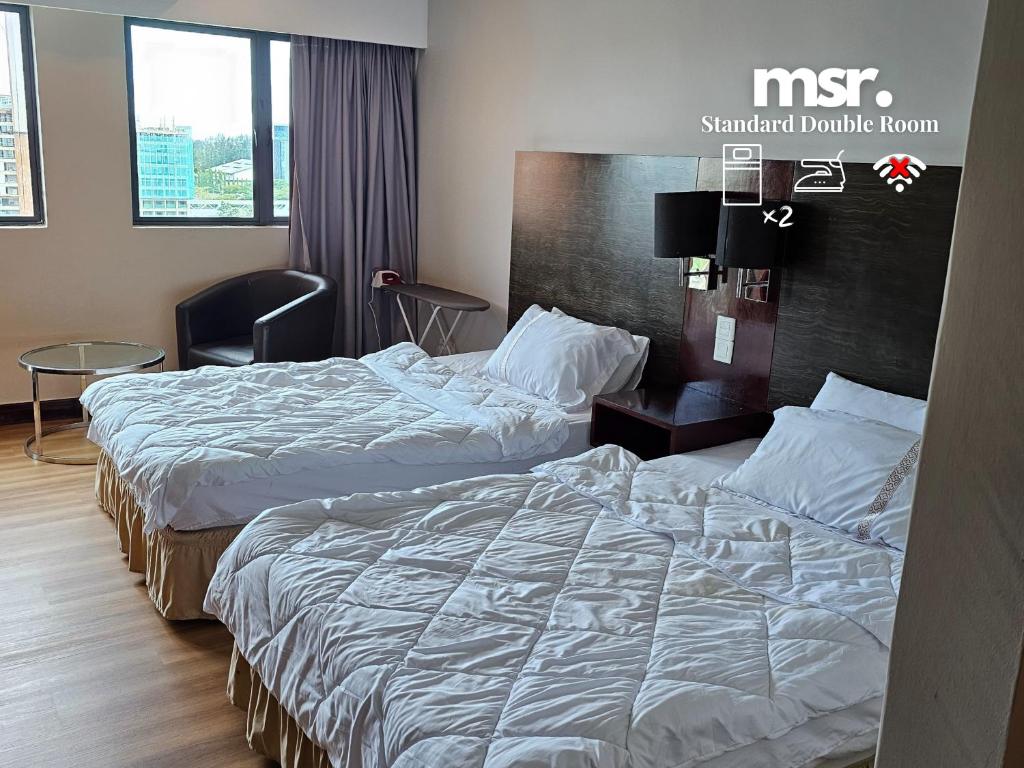 Postel nebo postele na pokoji v ubytování Kota Kinabalu City Ensuite at SCSP Ming Garden