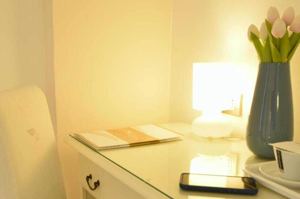Postel nebo postele na pokoji v ubytování Hotel L'Arcangelo - Boutique Hotel