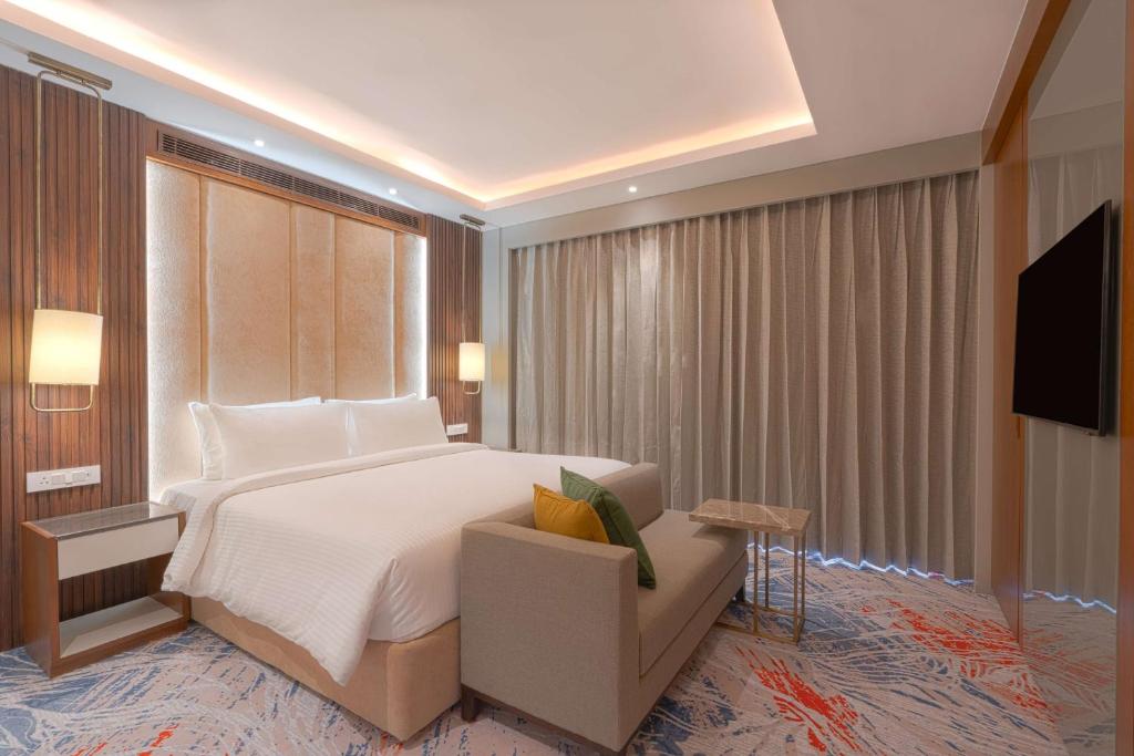 Postel nebo postele na pokoji v ubytování Park Inn by Radisson Ayodhya