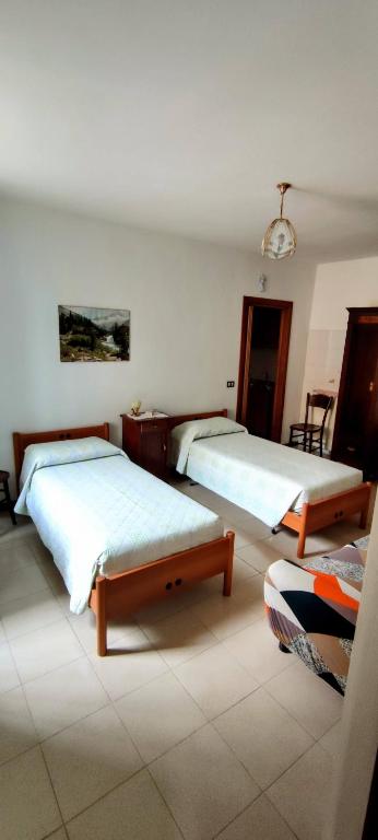 Postel nebo postele na pokoji v ubytování Casa Affitto Daone