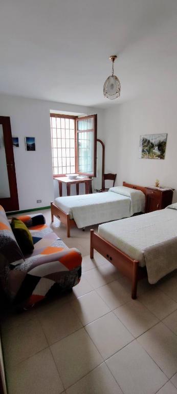 Postel nebo postele na pokoji v ubytování Casa Affitto Daone