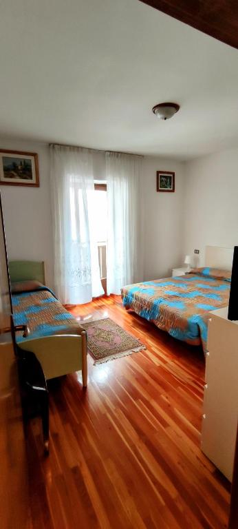 Postel nebo postele na pokoji v ubytování Casa Affitto Daone