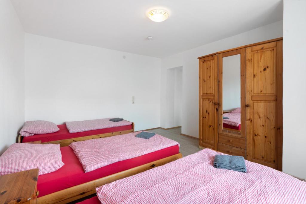 Postel nebo postele na pokoji v ubytování Knödelhof