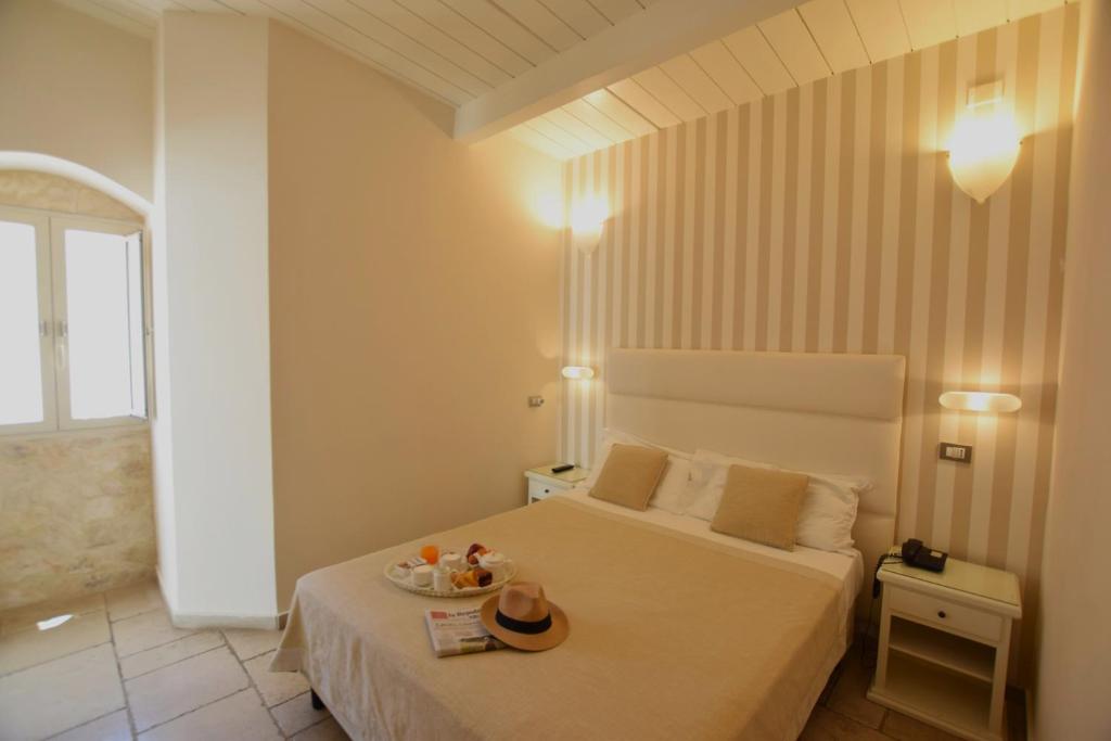 Postel nebo postele na pokoji v ubytování Hotel L'Arcangelo - Boutique Hotel