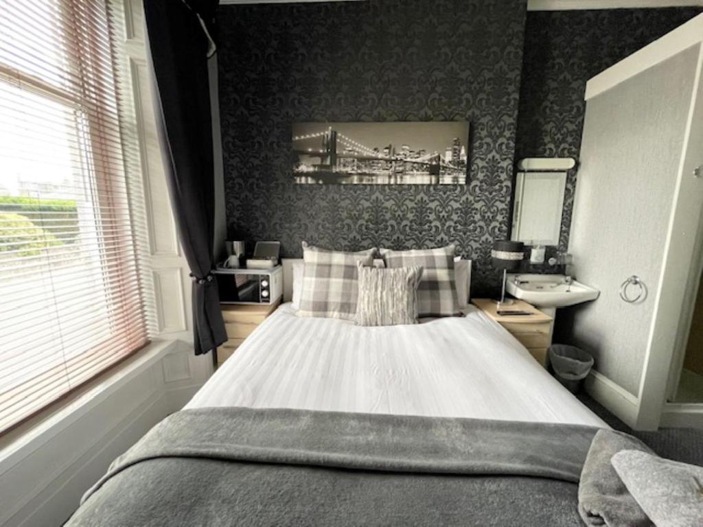 Postel nebo postele na pokoji v ubytování Vaila Guest House