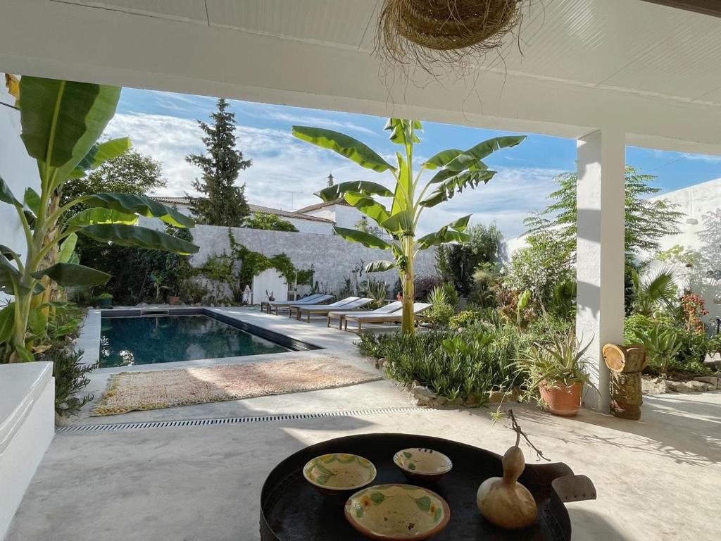 a patio with a table with plates of food on it at Casa Pimenta in Vidigueira