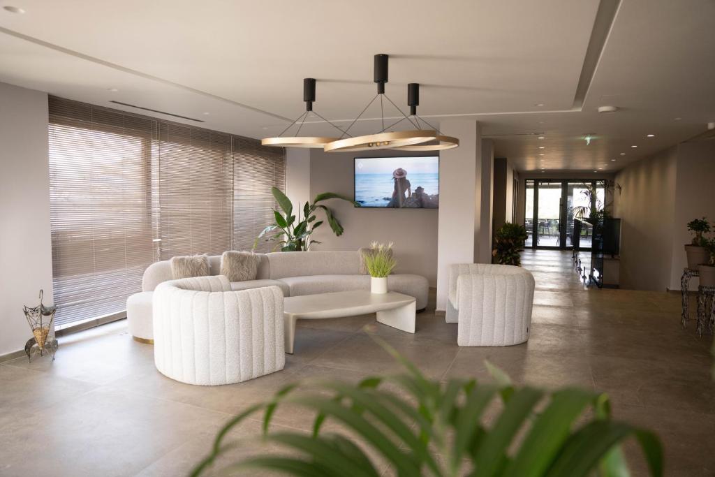 Posezení v ubytování Joelle Premium Hotel