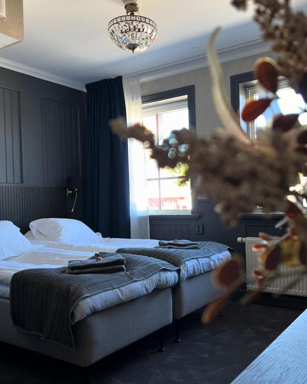 Postel nebo postele na pokoji v ubytování Central Hotellet Tierp